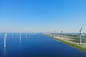 Faccin: onshore and offshore wind farm with wind turbines for green energy production