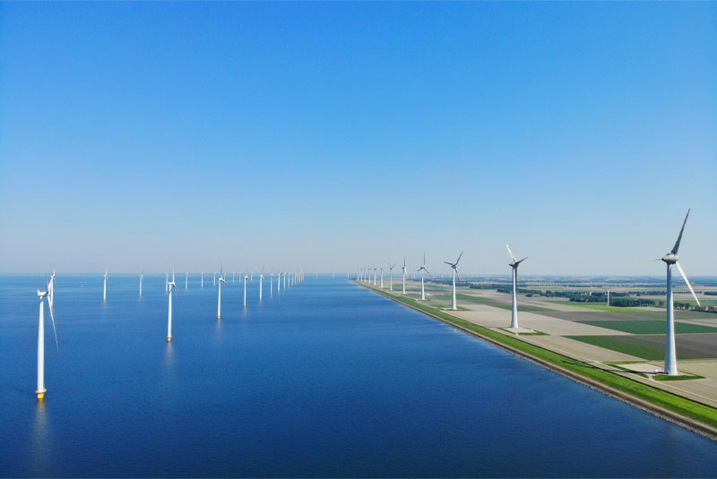Faccin: onshore and offshore wind farm with wind turbines for green energy production